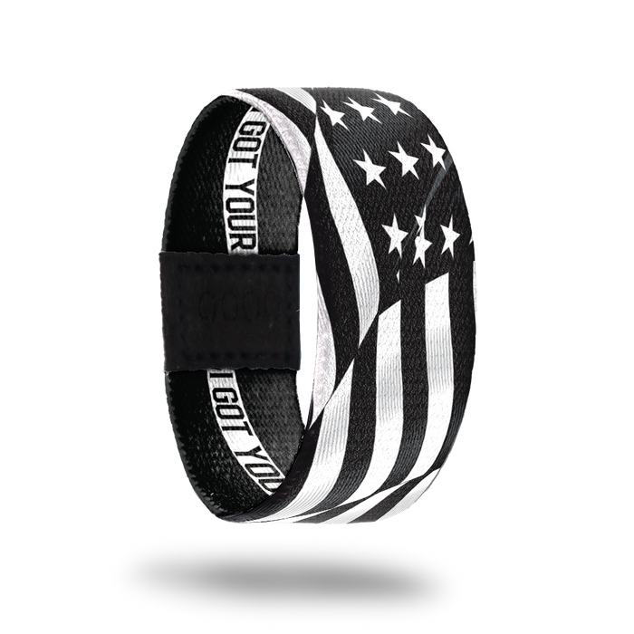 Outside Design of I Got Your Six. wavy black and white United States flag