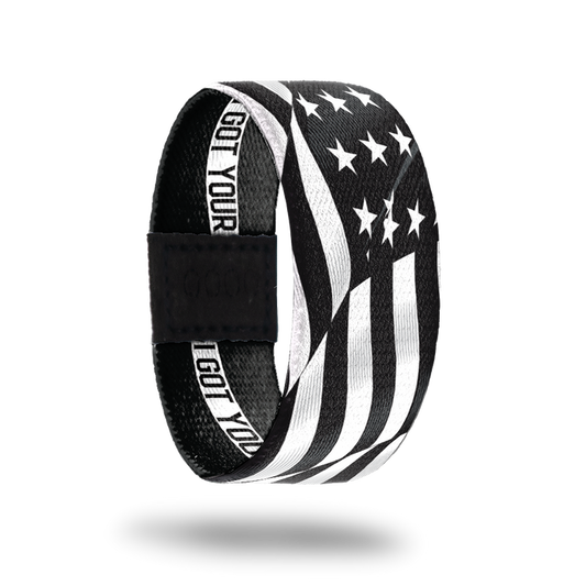 Outside Design of I Got Your Six. wavy black and white United States flag