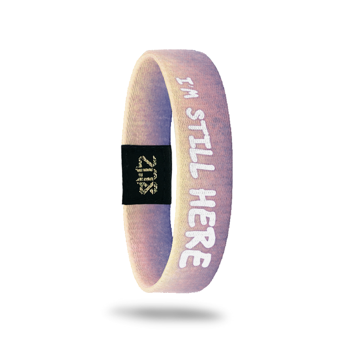 Inside Design of I’m Still Here: gradient from light purple to pale pink with white text overlaying ‘I’m Still Here’