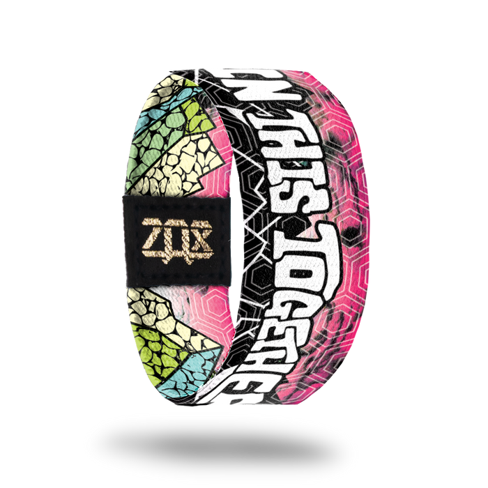Inside design of In This Together. Same pink background of the outside design and In This Together in large bold white text near the bottom of the design