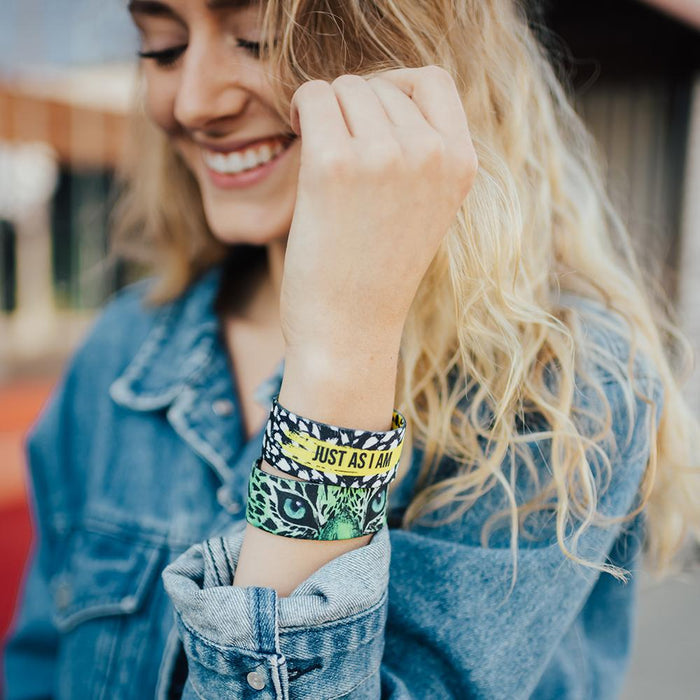 lifestyle image of a woman smiling with two Just As I Am on, both showing different color variants