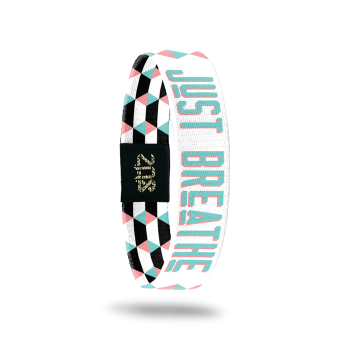 Inside Design of Just Breathe: geometric white and pink design with blue with pink outline text ‘Just Breathe‘
