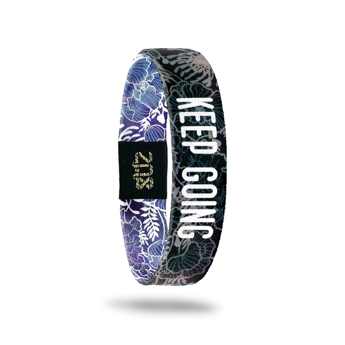 Inside Design of Keep Going: black and grey floral sketch with white text overlaying ‘Keep Going’