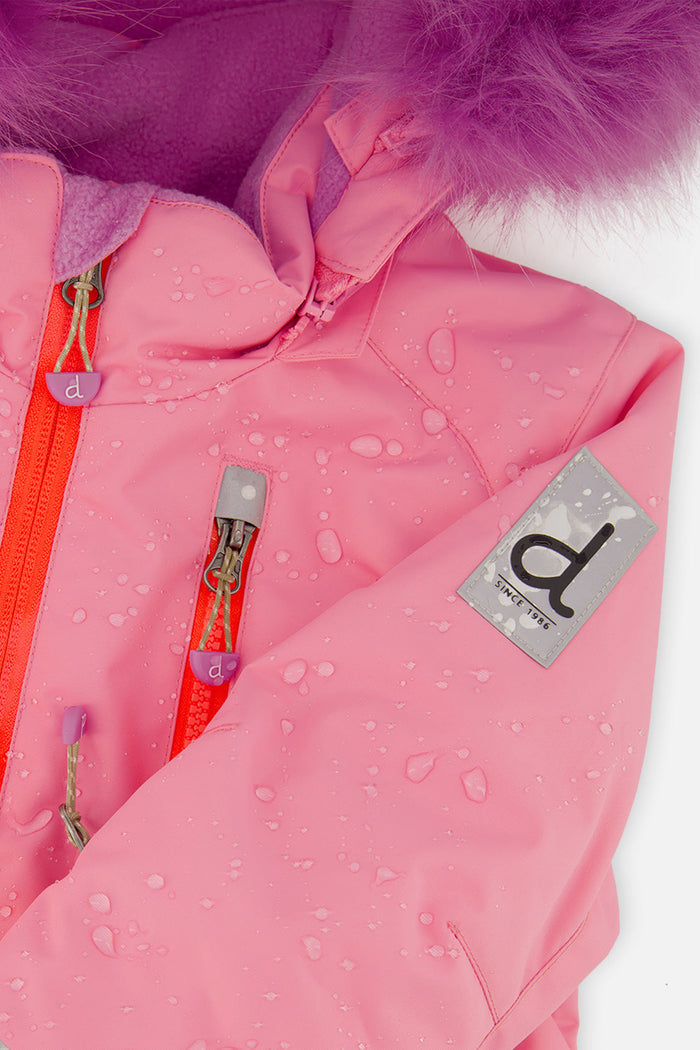 Close-up of the pink PLAY snowsuit chest zipper, pocket and Deux par Deux logo patch with water beading