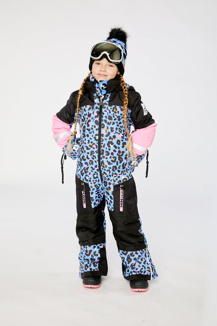 Child wearing the Deux par Deux TEKNIK one-piece snowsuit in blue leopard print, view 1
