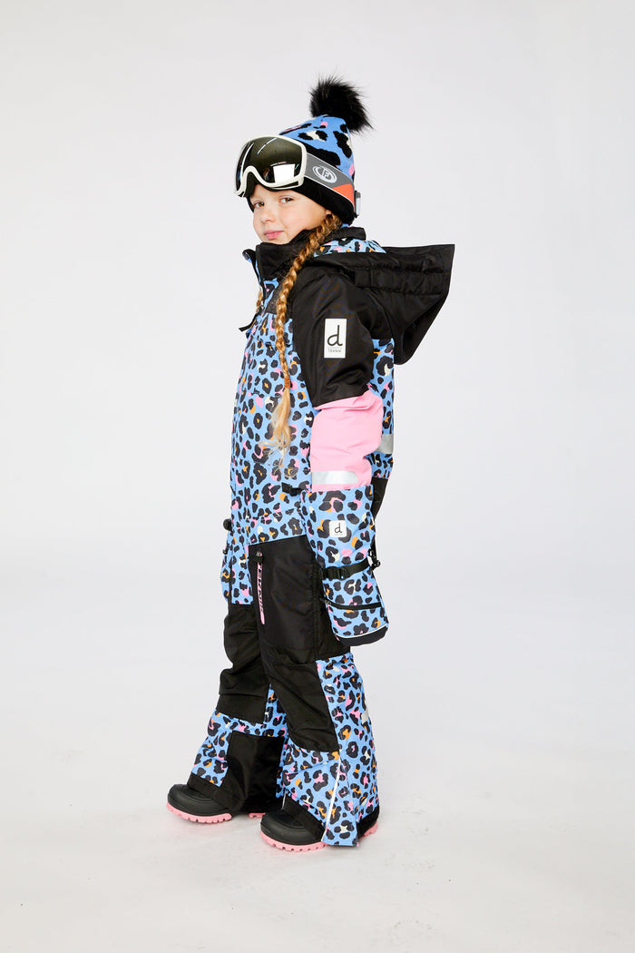 Child wearing the Deux par Deux TEKNIK one-piece snowsuit in blue leopard print, view 3