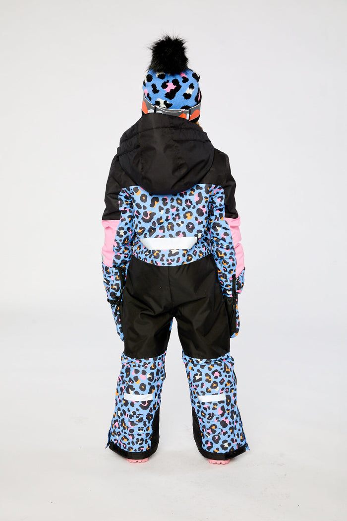 Child wearing the Deux par Deux TEKNIK one-piece snowsuit in blue leopard print, view 4