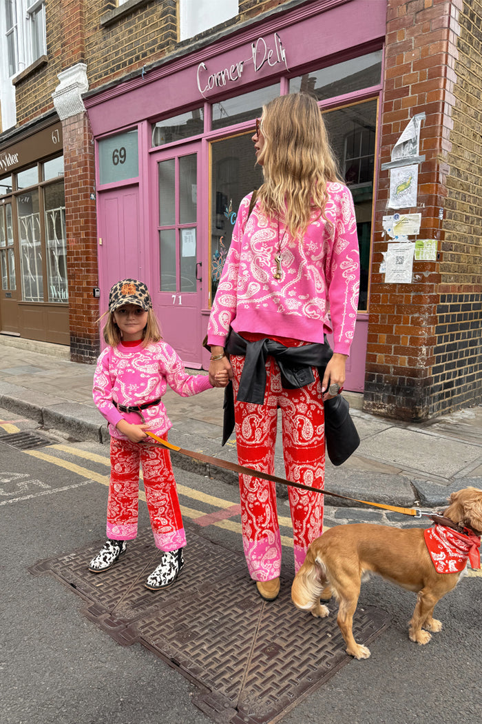 Kids Red and Pink Bandana Knitted Set styled on a young girl with a coordinated adult outfit on a London street.