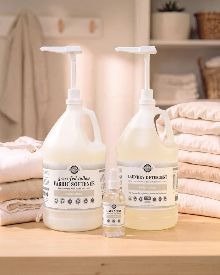 Rustic Strength - Laundry Refill Bundle | Fresh Linen containing Tallow Fabric Softener, Laundry Detergent and Linen Spray in a laundry room with folded linens