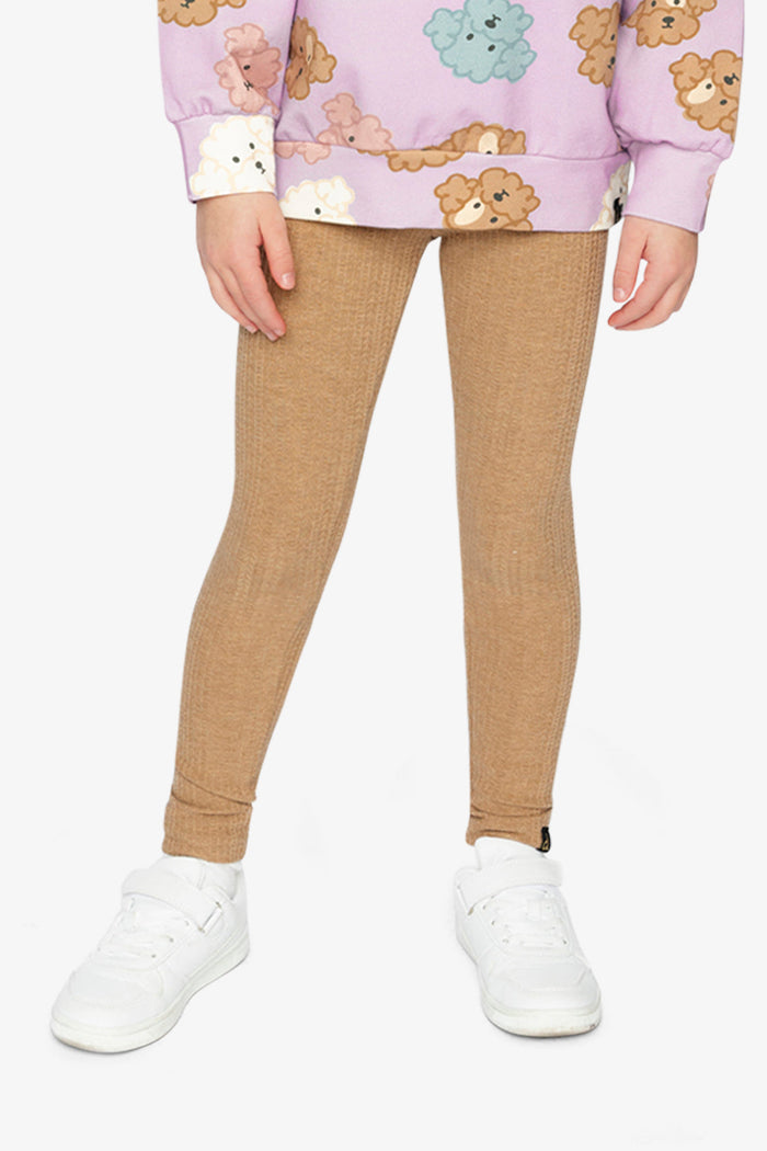 Child wearing the Deux par Deux brown chevron jacquard leggings, view 2