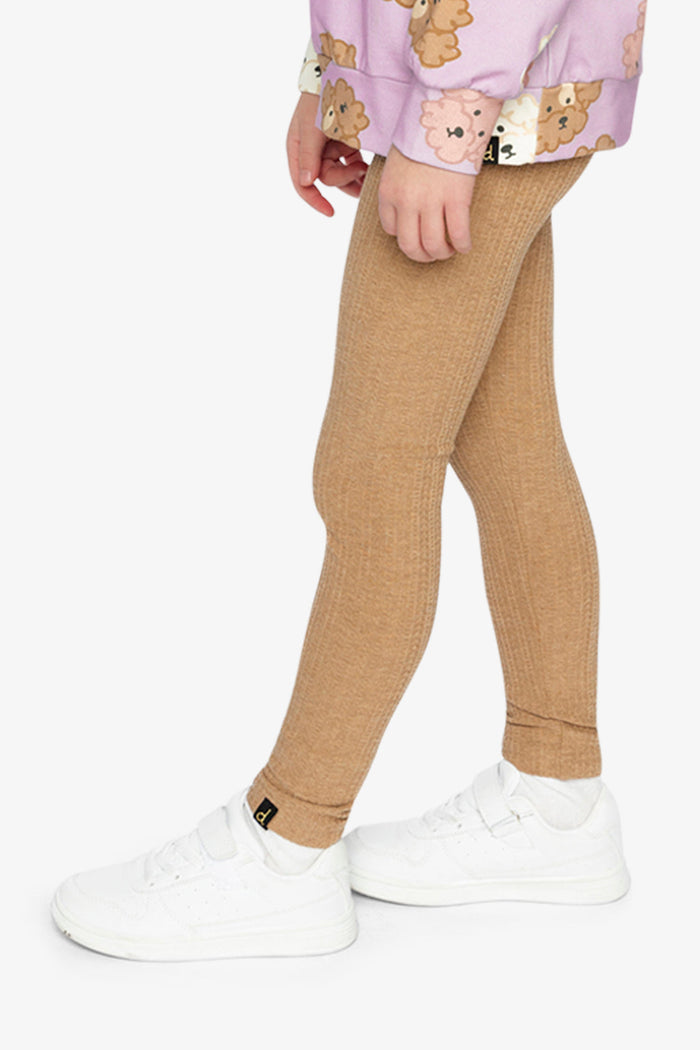 Child wearing the Deux par Deux brown chevron jacquard leggings, view 3