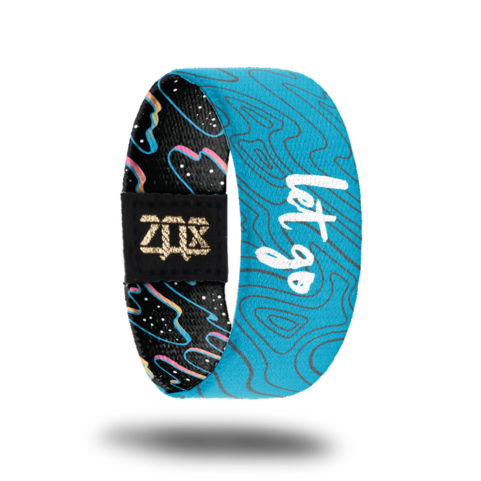 Inside design of Let Go. Light blue background with thin grey wavy lines and Let Go in the center in white text