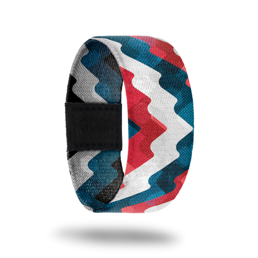 Outside design of Live Happily. Thick wave lines across the strap in red, white, and blue.