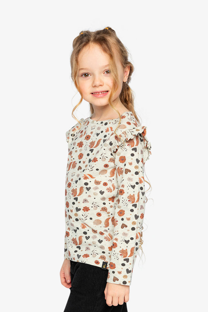 Child wearing Deux par Deux long sleeve organic cotton tee, beige squirrel print, lookbook view 2