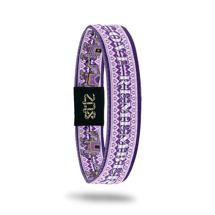 Product photo of the inside of Love Remembers. It is mainly purple to show we're fighting against Alzheimer's. The name Love Remembers is shown and there's a geometric background that is purple