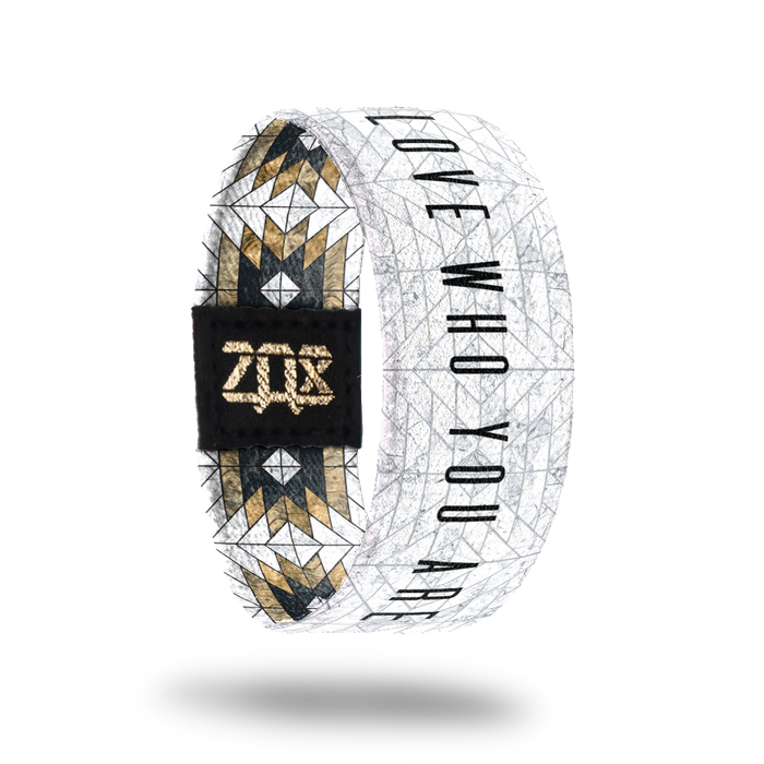 Inside design of Love Who You Are. White background with thin faded gray pattern lines. Love Who You Are centered and in black font
