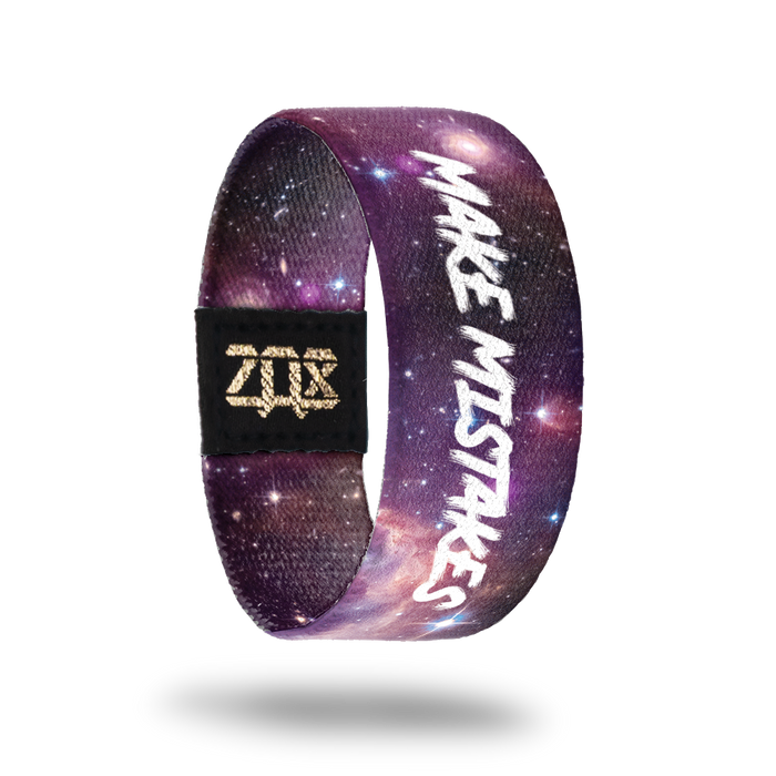Inside design of Make Mistakes. Shades of purple for the open space design with a few stars spread out. Make Mistakes in white text in the middle