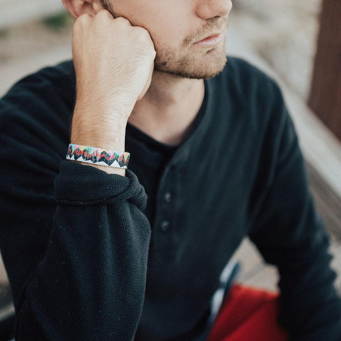 Lifestyle close up image of someone thinking and wearing Mountains To Molehills