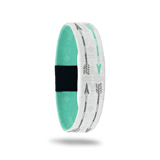Outside Design of Never Give Up: white and light grey tribal design with grey and turquoise arrows overlaying