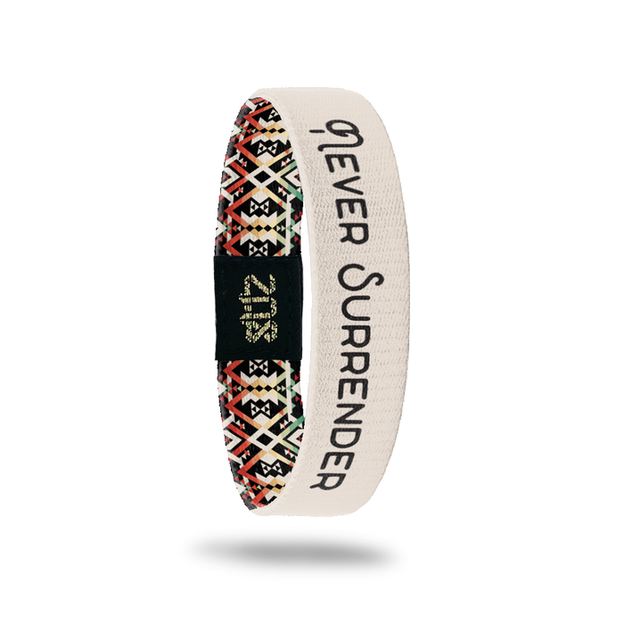 Inside Design of Never Surrender: tan background with black text overlaying ‘Never Surrender’