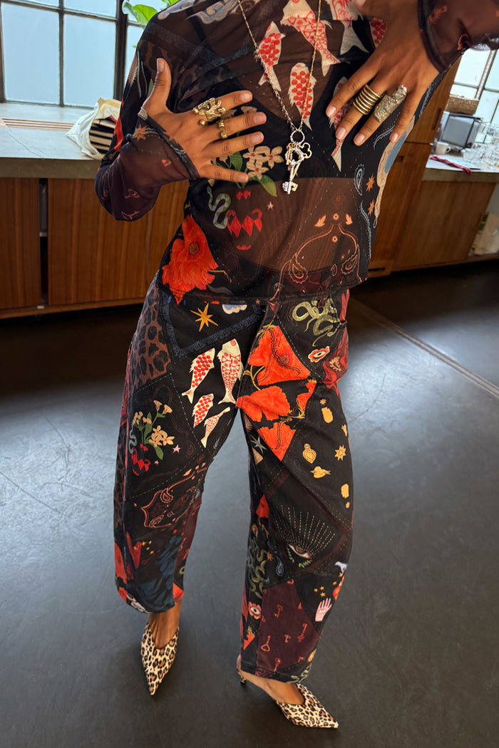 Night Garden Barrel Jeans in black featuring leopard and poppy motifs, styled with leopard print pointed heels.