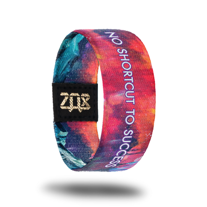Inside design of No Shortcut To Success. A blended background of pink, orange, and light purple. Centered on the design is No Shortcut To Success in white text with a purple outline around the letters