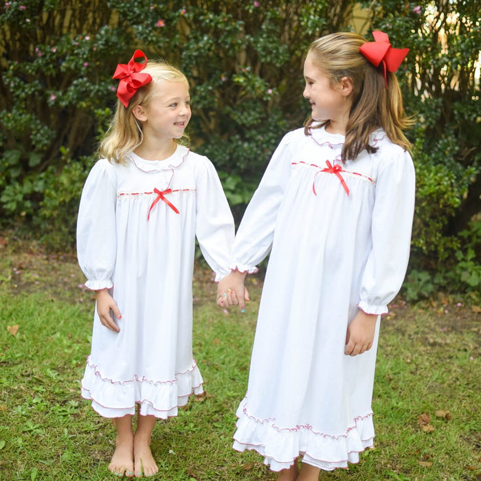 white knit clara nutcrakcer gown dress red ribbon trim and frills