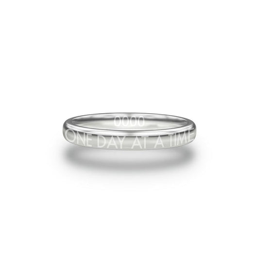 Front design of One Day At A Time silver ring with sketched in text ‘One Day At A Time’
