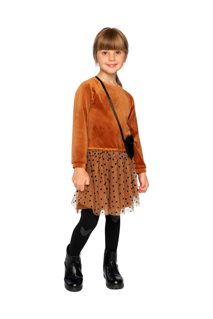 Child wearing Deux par Deux black organic cotton leggings with heart knee patches, full outfit lookbook view