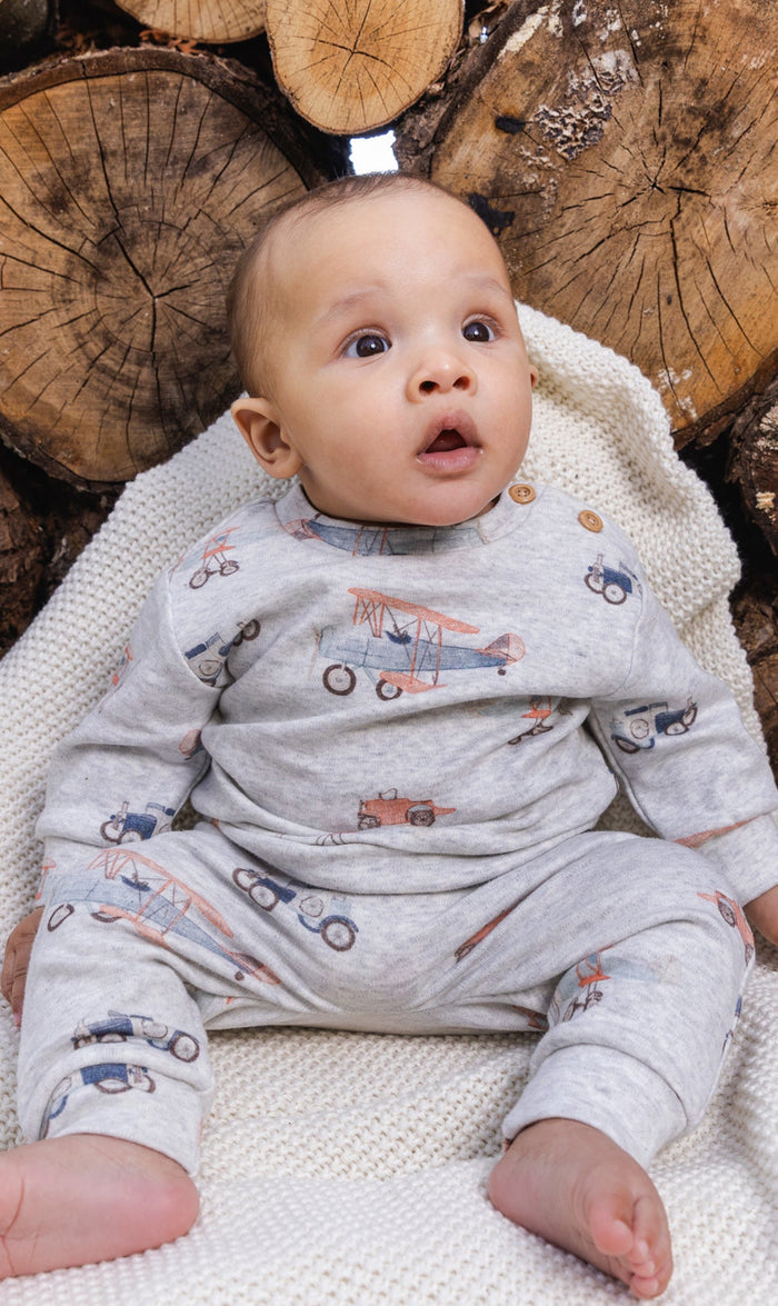 Baby wearing the Deux par Deux top and pants set in beige vintage airplane print, view 2