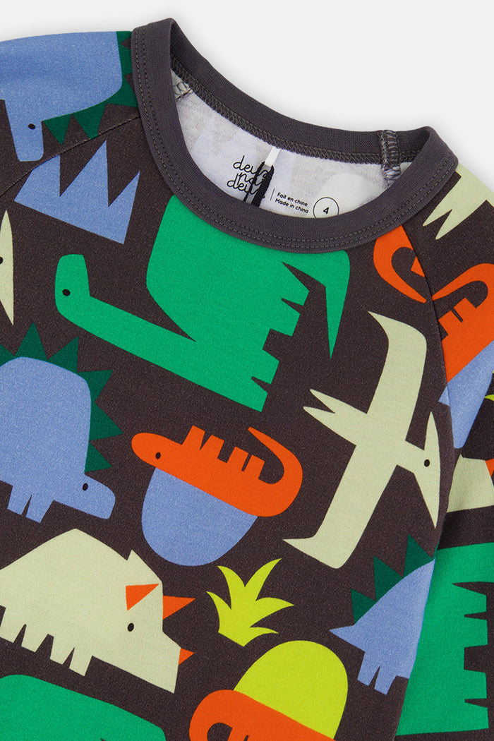 Close-up detail of the Deux par Deux black dinosaur print organic cotton pajama set