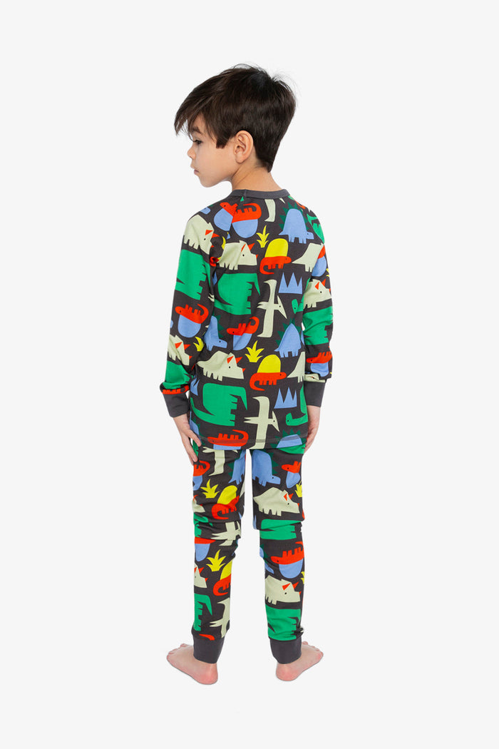 Child wearing the Two Piece Pajama Set Black Dinosaur Print by Deux par Deux, lookbook photo 3