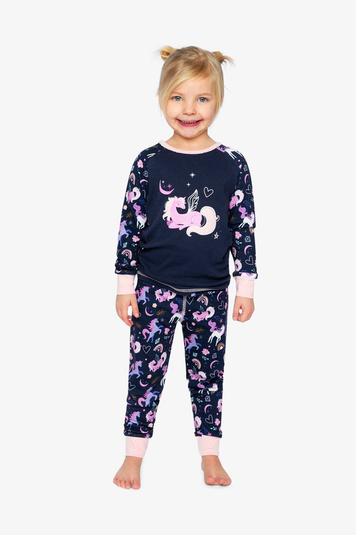 Child wearing the purple unicorn print two-piece pajama set by Deux par Deux, lookbook photo 1