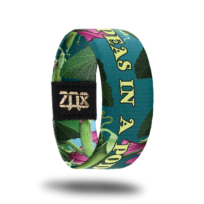 Inside design for Peas In A Pod. Dark teal background with a few pink flowers and green plant life. Centered is Peas In A Pod in yellow-green text