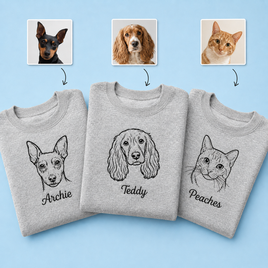 navy sweatshirt with embroidered pet portrait line drawing and pet name on chest