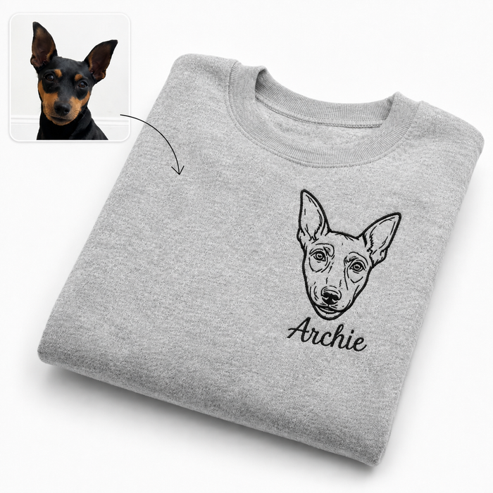 grey sweatshirt showing embroidered dog portrait design with personalised name