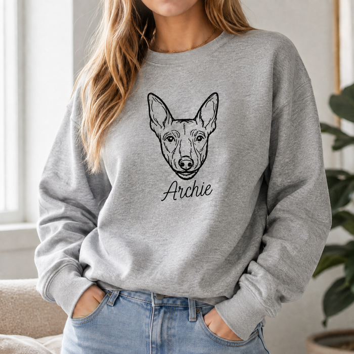 black sweatshirt with embroidered cat portrait and custom name in decorative font