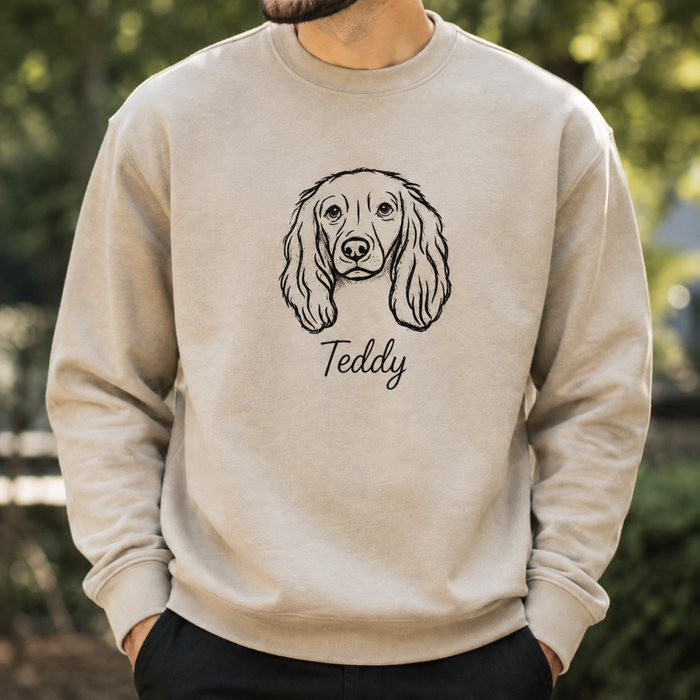 cream sweatshirt featuring hand-stitched pet line art design detail