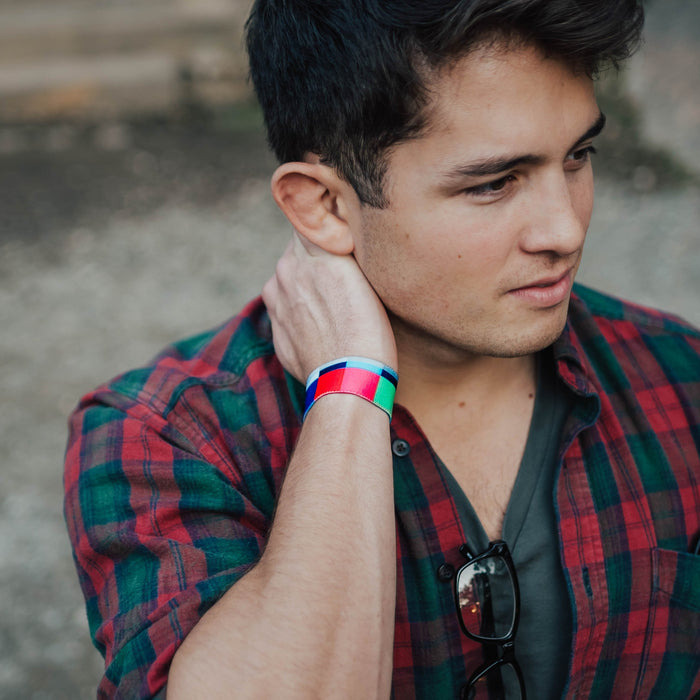 Lifestyle close up of Please Stand By on someone's wrist