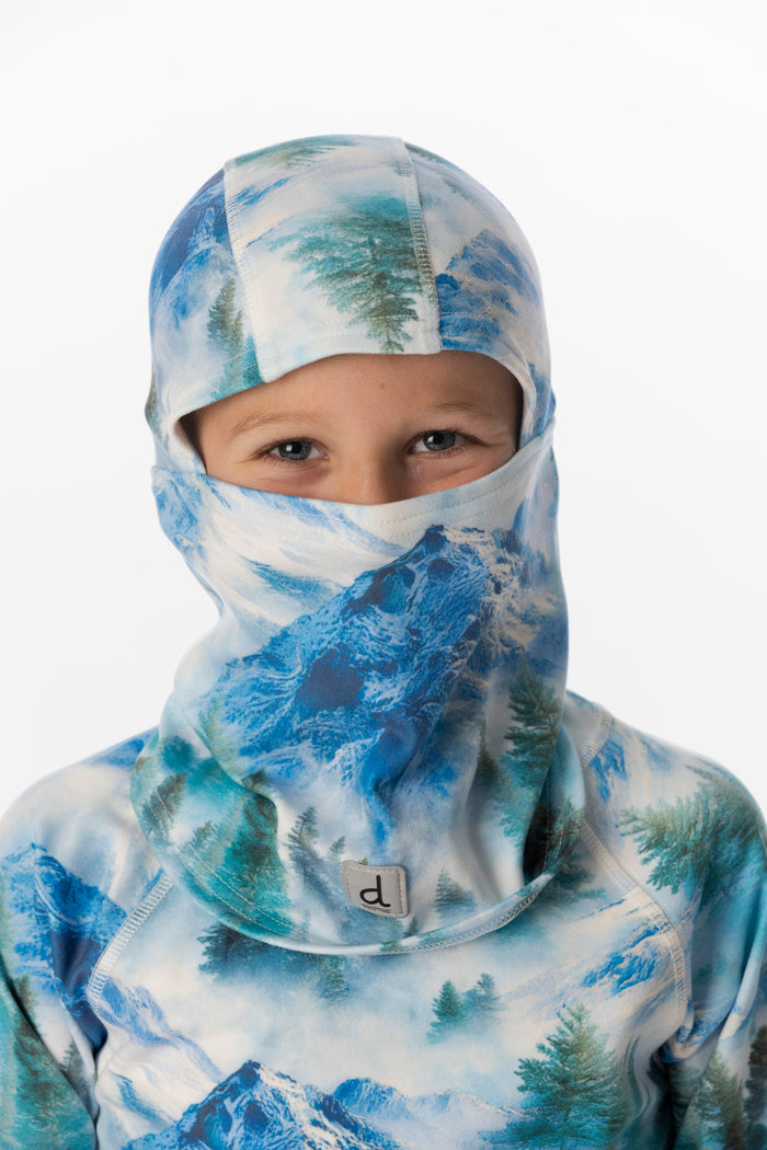Deux par Deux boys' polar fleece balaclava in blue mountain print – worn by a model
