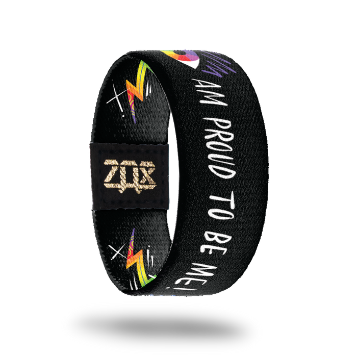 Inside design for Pride. Black background with and illustrated colorful eye image followed by Am Proud To Be Me! in white text