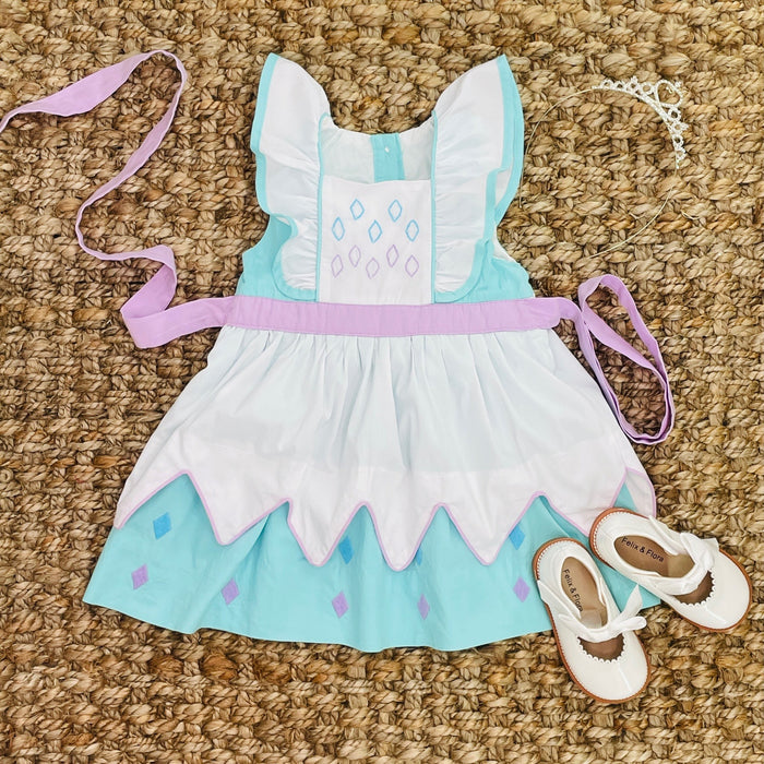 A princess dress inspired by Elsa from Frozen with blue, white, and pink colors, hand embroidered details