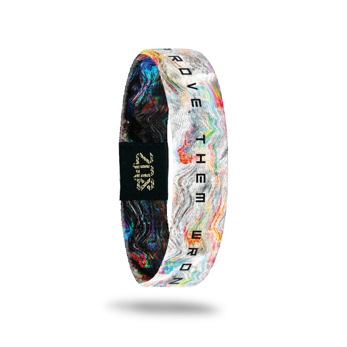 Inside Design of Prove Them Wrong: white background with blue, white, red, green, and orange wave design with black text overlaying ‘Prove Them Wrong’