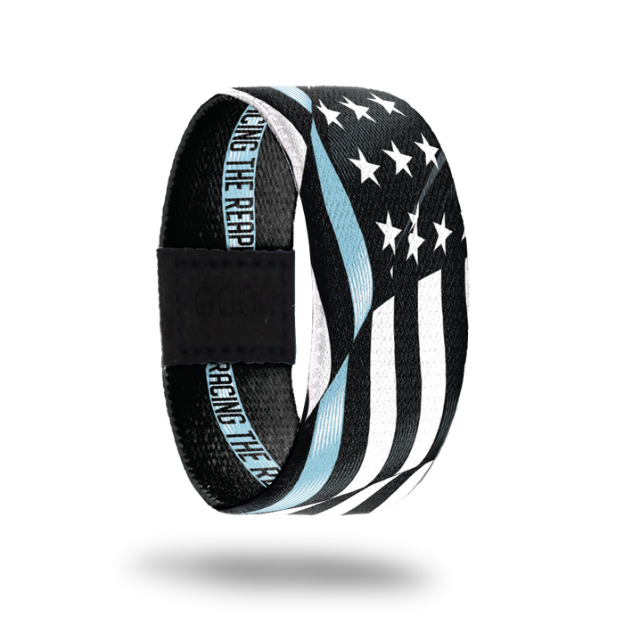 Outside Design of Racing The Reaper. A wavy black and white United States flag with a line of light blue for one bottom stripe of the flag