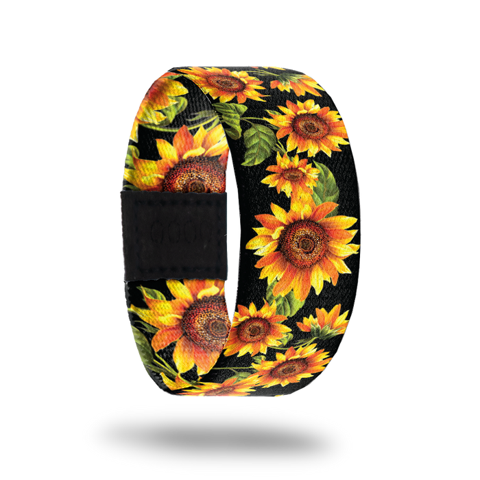 Outside Design of Radiate Positivity: black background with bright yellow sunflowers on their stems throughout