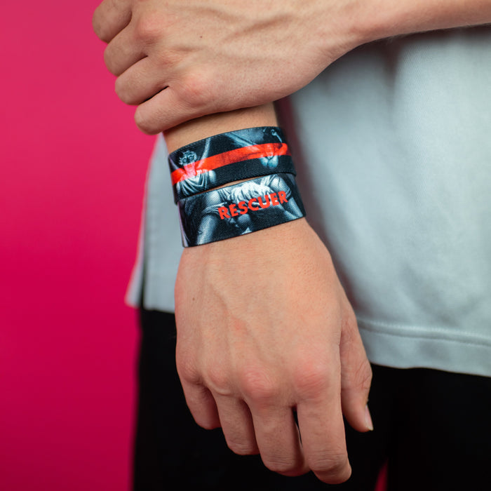 Studio image close up of 2 Rescuer on someone's wrist