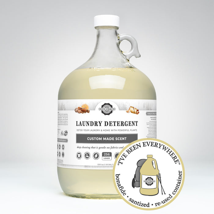 Rustic Strength, Laundry Detergent, 1 Gallon, Glass Jug, Sweet Orange Warm Spices & Cedarwood, with image "I've been everywhere - Bonafide, Sanitized, Re-used Container"