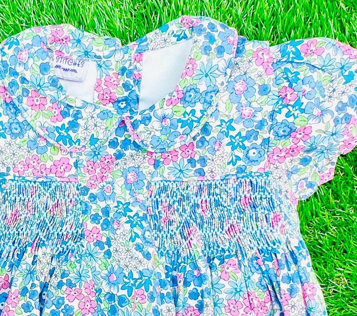 Peter pan collar and sweet smocking are timeless details at an affordable price. Perfect for achieving Princess Charlotte style for less.