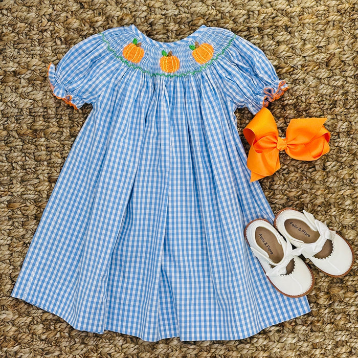 A blue and white gingham dress with pumpkin smocking