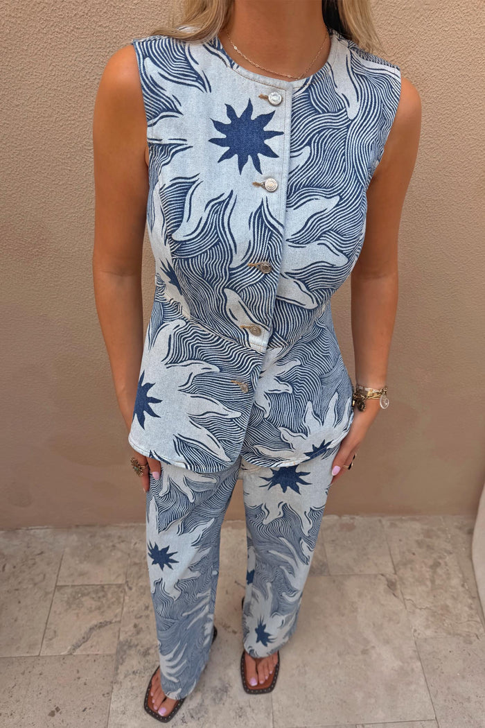 Sleeveless Soleil Denim Waistcoat featuring a blue sun motif print and button front, styled as a co-ord.